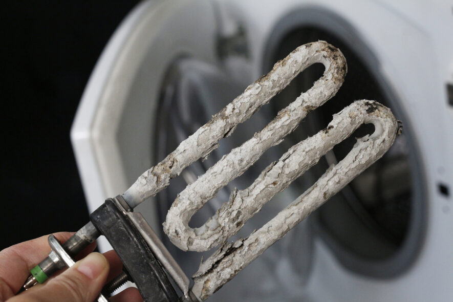 Intermittent Hot Water Dropouts Caused by Scale Flakes Breaking Loose in Aging Tanks